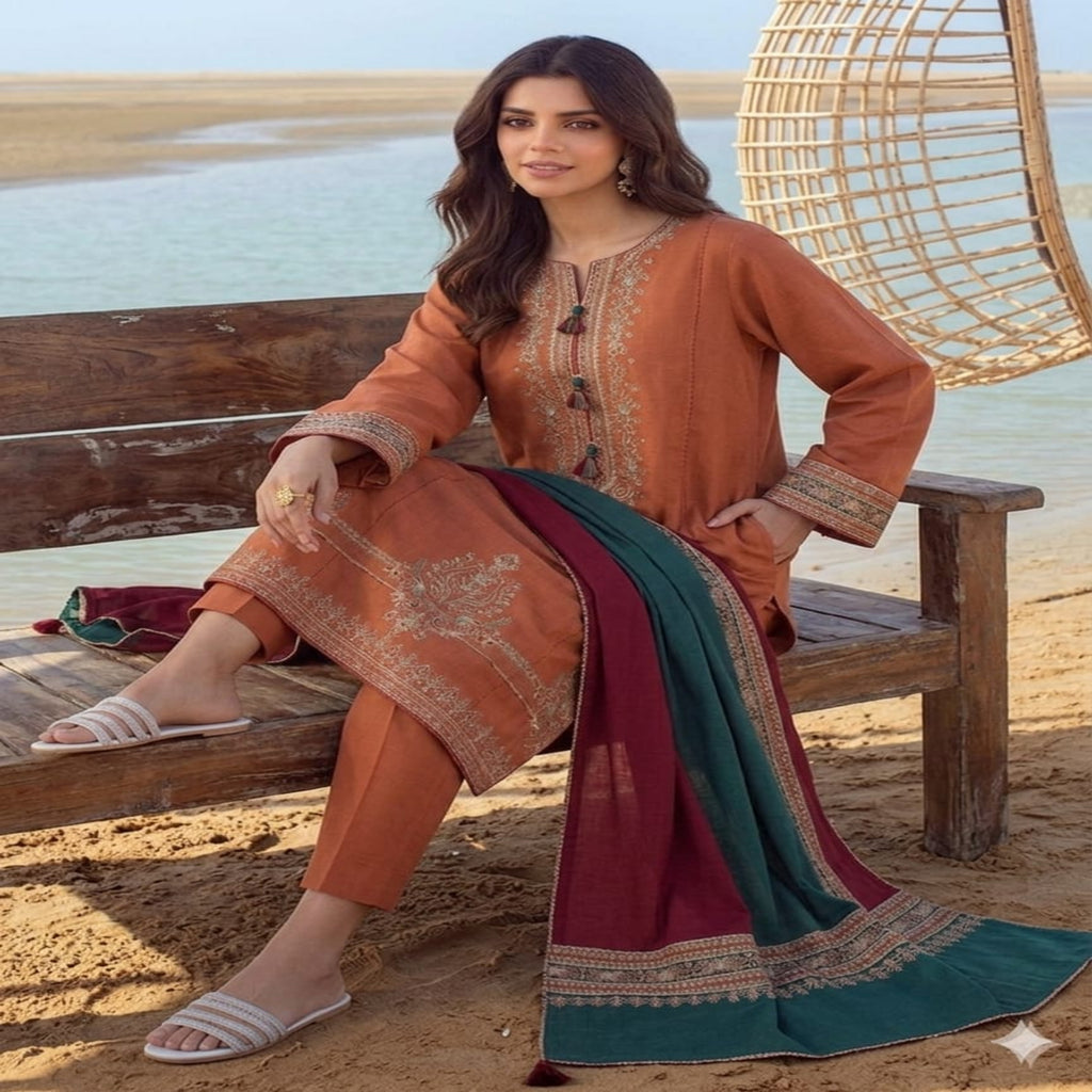 Woman in traditional outfit sitting on a wooden bench by a water body